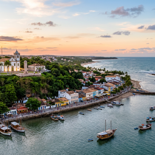 Aerial view of a colorful coastal town, church, beach, and fishing boats